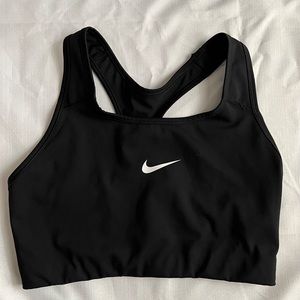 Black Nike sports bra with paw print
